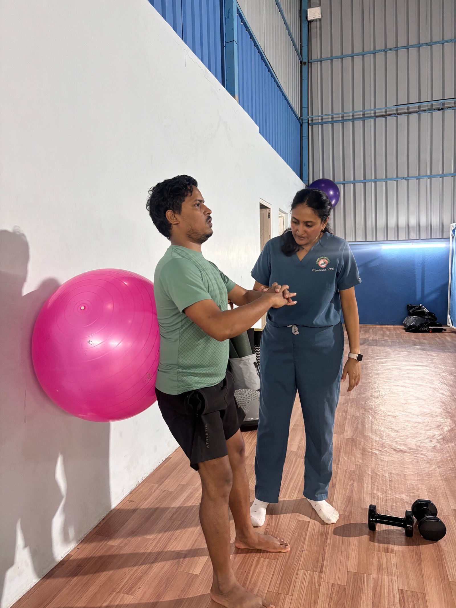 Priyadarshini, lead physiotherapist, treating a patient at Healthroughtouchh clinic, Neotown, Bangalore